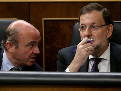 Luis de Guindos y Mariano Rajoy