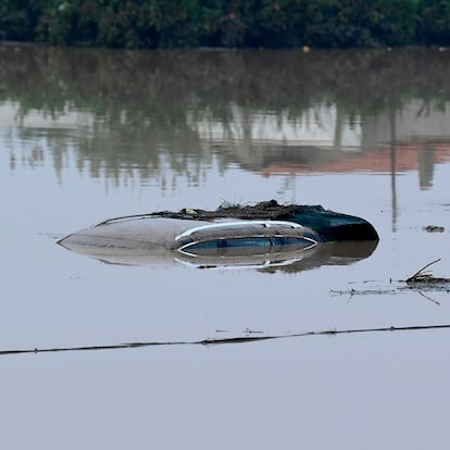 The roof of a car submerged in water following floods is pictured in Picuana, near Valencia, eastern Spain, on October 30, 2024. Floods triggered by torrential rains in Spain's eastern Valencia region has left 51 people dead, rescue services said on Wednesday. (Photo by Jose Jordan / AFP) (Photo by JOSE JORDAN/AFP via Getty Images)