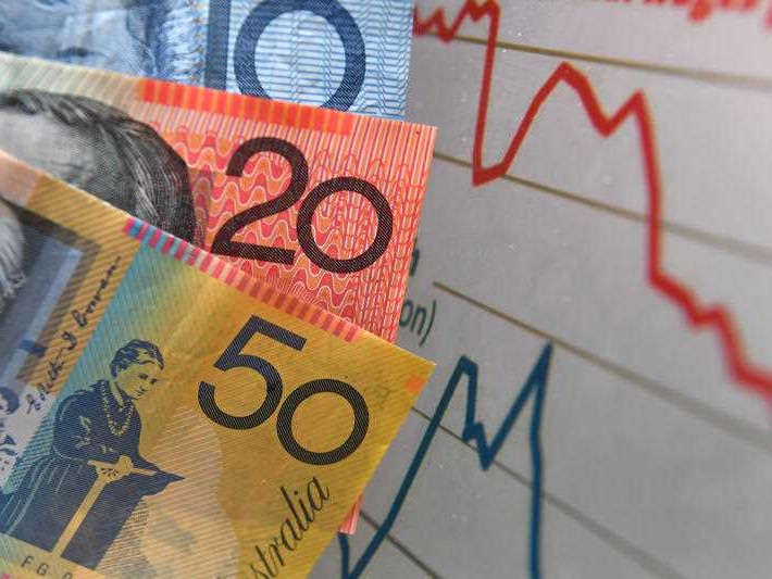 Australian currency is seen next to a wages graph