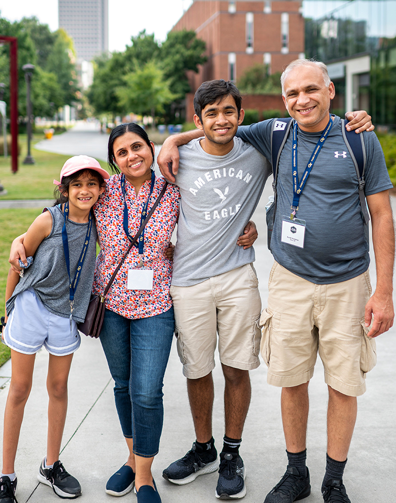 Asian family of four: daughter, mom, son and dad.