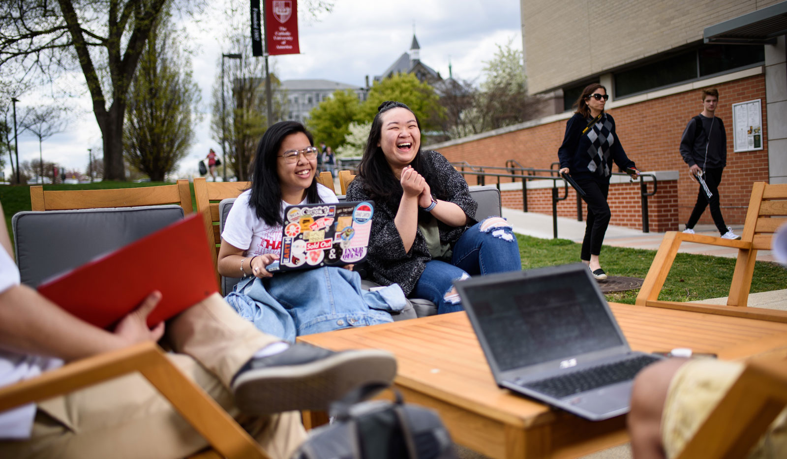 Student laughing outside